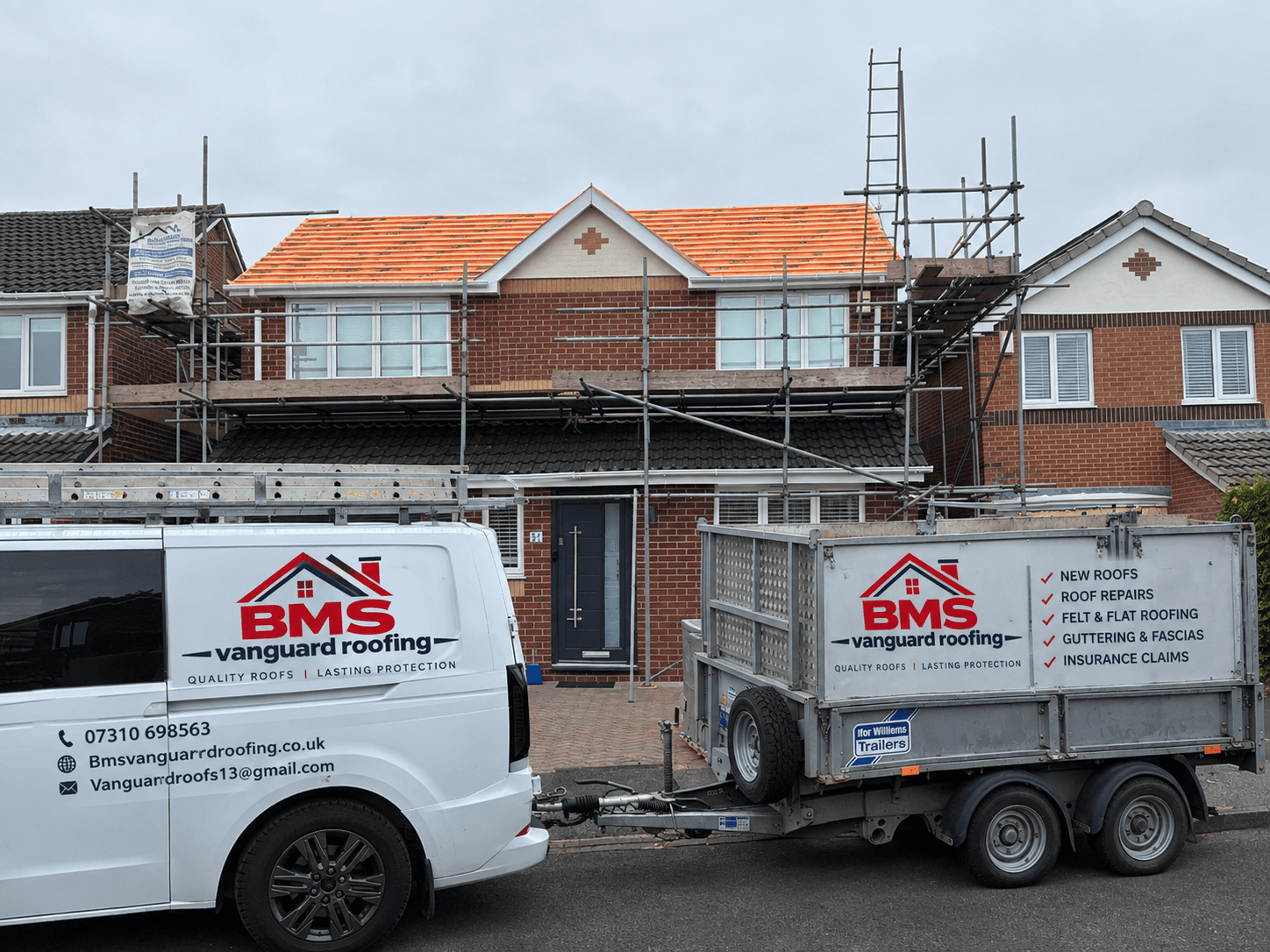 BMS Vanguard Roofing van and trailer on site with scaffolding